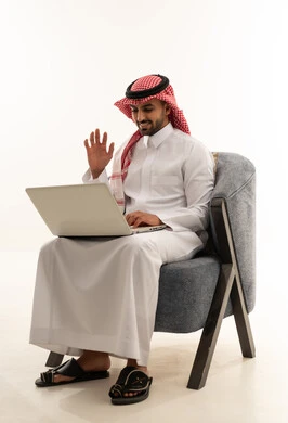 Saudi Man with Laptop on White Background