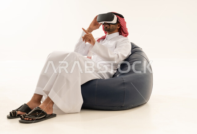 Saudi Man Using VR Headset on Bean Bag