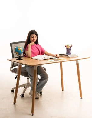 Arab Girl Studying at Wooden Desk on White Background