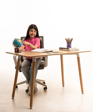 Saudi Girl Student with Globe at Desk for Education