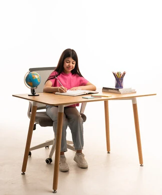 Arab Student Girl Writing at Desk on White Background
