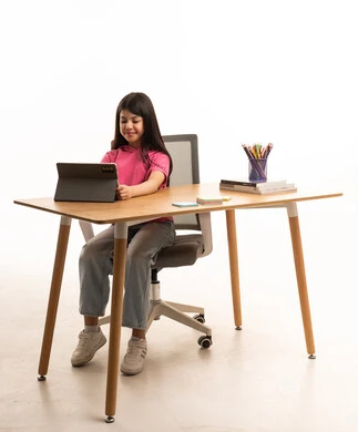 Saudi Girl Using Tablet at Desk in White Studio