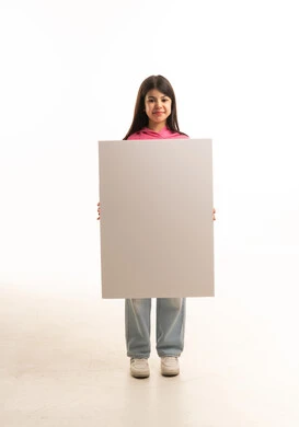Arab Girl Holding Blank White Poster Board in Studio