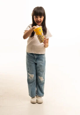 Saudi Girl Holding Popcorn Bucket on White Background