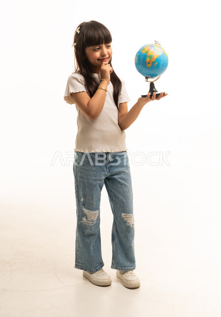 Saudi Girl Holding Terrestrial Globe in Thinking Pose