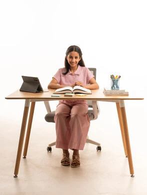 Saudi Girl Student at Desk with Tablet and Book