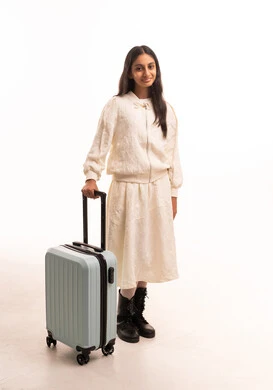 Saudi Girl with Suitcase on White Background