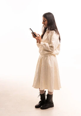 Arab Girl Using Smartphone in Studio Setting