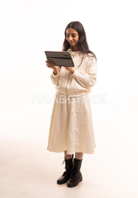 Saudi Woman with Digital Tablet in White Studio