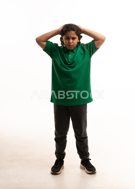 Stressed Saudi Boy in Green Polo on White Background