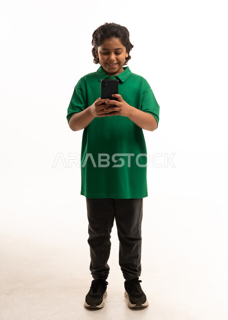 Saudi Boy Using Smartphone on White Background