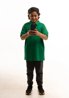 Saudi Boy Using Smartphone on White Background