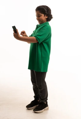Saudi Boy Using Smartphone on White Background