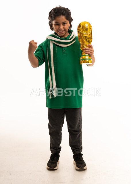 Saudi Boy Celebrating with Gold Trophy