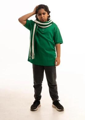 Confused Saudi Boy in Green Shirt on White Background