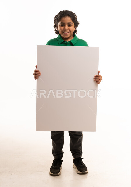 Saudi Boy Holding Blank White Sign on White Background