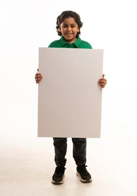 Saudi Boy Holding Blank White Sign on White Background Saudi Boy Holding Blank White Sign on White Background