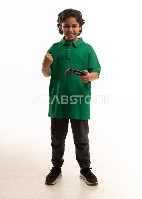 Saudi Boy Holding Game Controller on White Background
