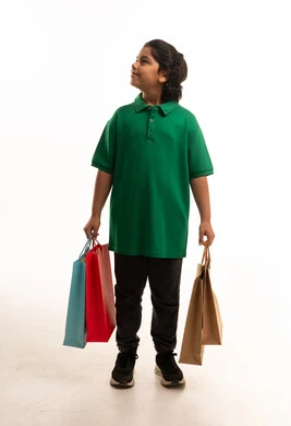 Arab Saudi Boy Holding Shopping Bags on White Background