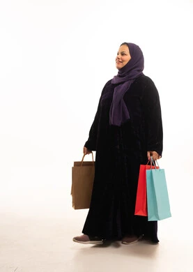 Saudi Woman in Abaya Walking with Shopping Bags