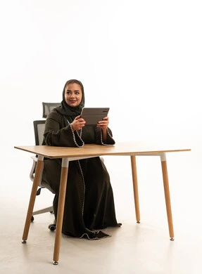 Emirati Businesswoman with Tablet in Office