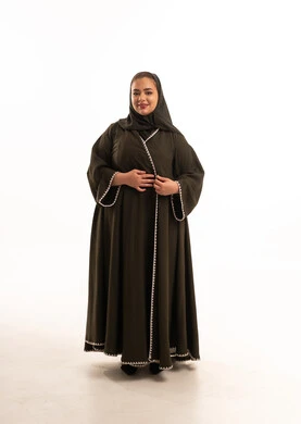 Saudi Woman in Traditional Green Abaya on White Background