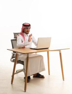 Saudi Man Using Laptop for Video Call