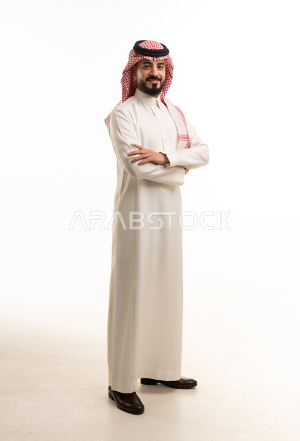Saudi Man in Traditional White Thobe and Shemagh