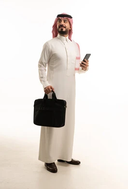 Saudi Businessman in Thobe with Smartphone and Bag