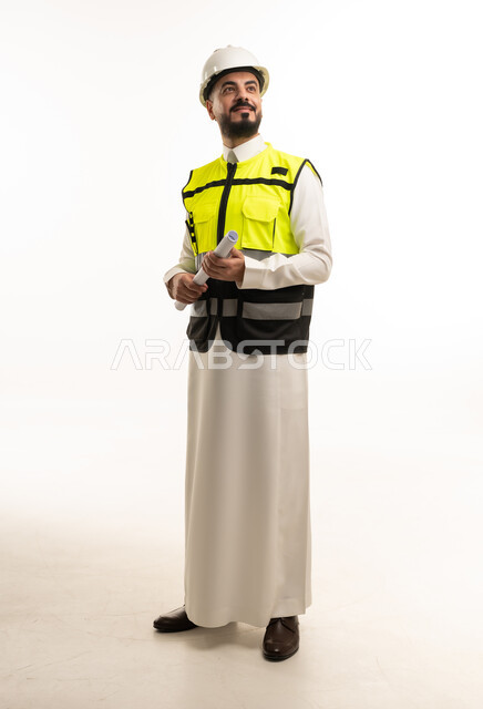 Saudi Male Engineer in Safety Gear with Blueprint