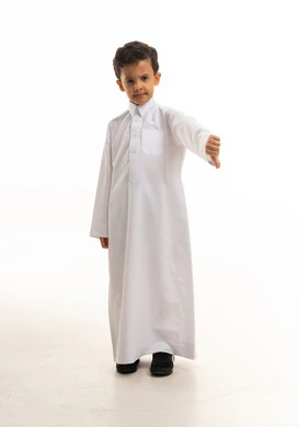 Saudi Boy in White Thobe Making Thumbs Down Gesture