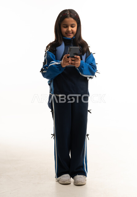 Saudi School Girl Using Smartphone on White Background