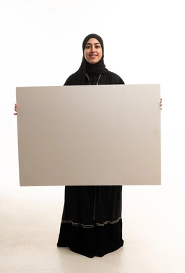 Saudi Woman in Abaya Holding Blank Whiteboard