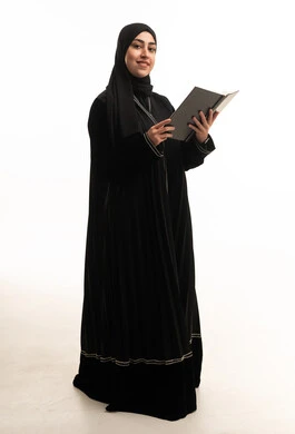 Saudi Woman in Black Abaya Holding Book