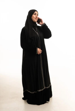 Arab Woman in Black Abaya Talking on Smartphone