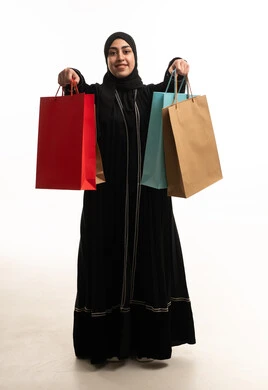 Saudi Woman in Abaya Holding Shopping Bags