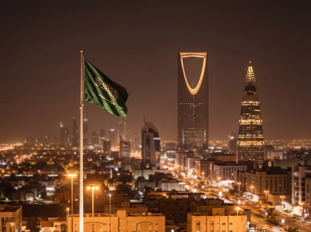 Riyadh City Skyline with Saudi Flag and Kingdom Centre at Night