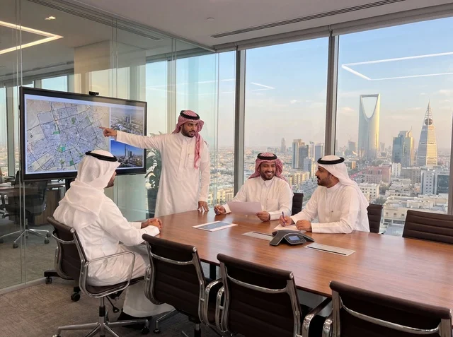 Saudi Businessmen Riyadh Office Meeting with City Skyline