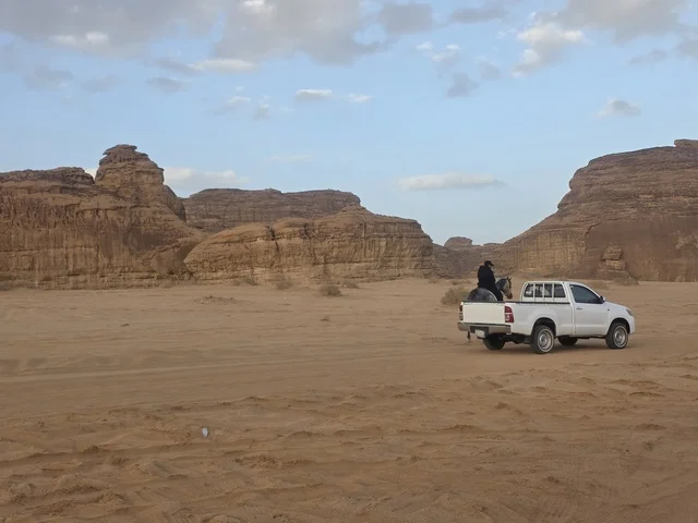 White Pickup Truck in Al-Ula Saudi Arabia Desert Landscape