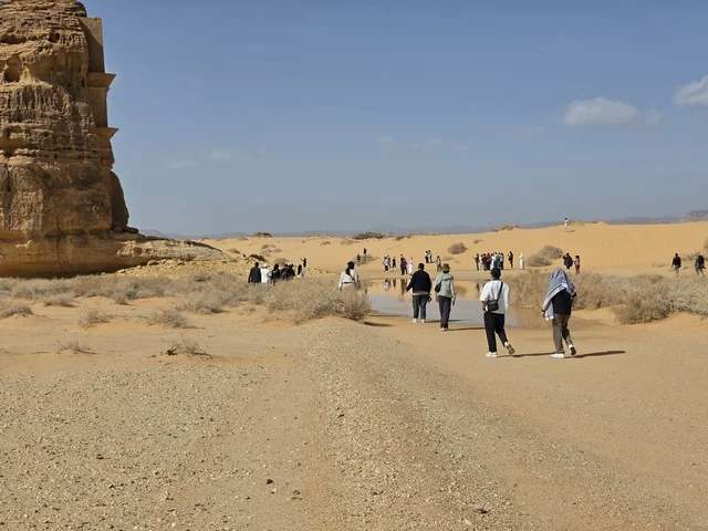 Tourists Exploring AlUla Desert Landscape Saudi Arabia