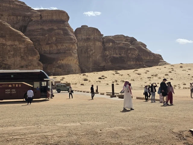 Tourists and Tour Bus at AlUla Desert Mountains