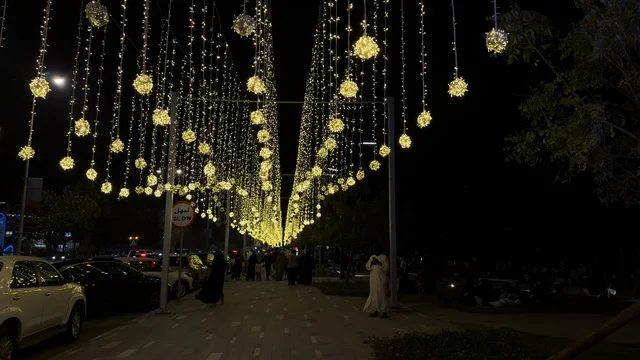 Eid Celebrations in Dammam with Hanging Lights at Night Eid Celebrations in Dammam with Hanging Lights at Night