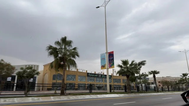 Dammam Street with Eid Holiday Banners and Palm Trees