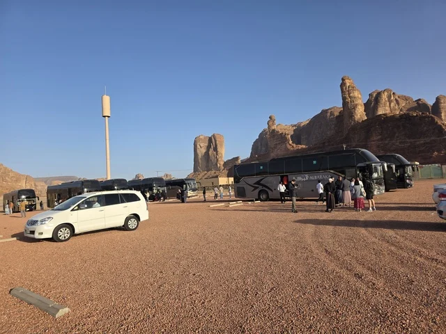 Tour Buses and Tourists in AlUla Desert Landscape