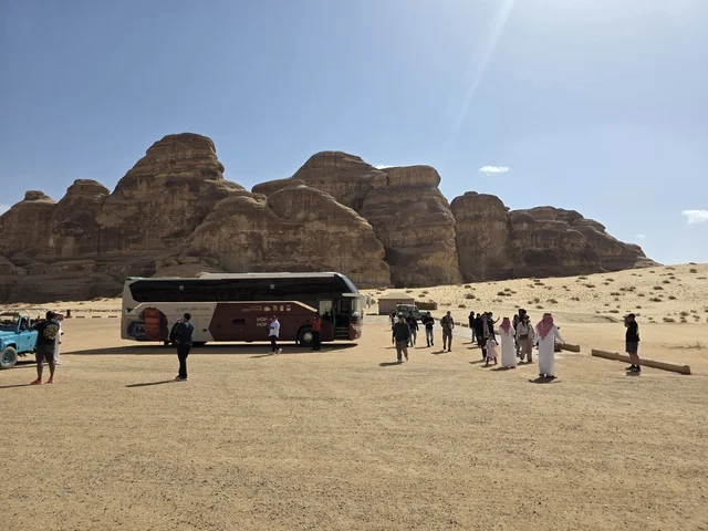 Natural sandy rock formations in the Al-Ula desert in the Kingdom of Saudi Arabia. Daylight highlights the geological terrain and sandy land under a clear sky, tourism in Al-Ula.