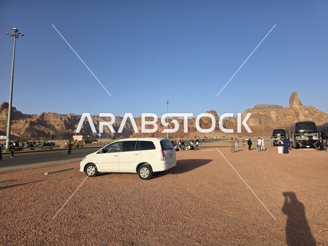 Natural sandy rock formations in the Al-Ula desert in the Kingdom of Saudi Arabia. Daylight highlights the geological terrain and sandy land under a clear sky, tourism in Al-Ula.