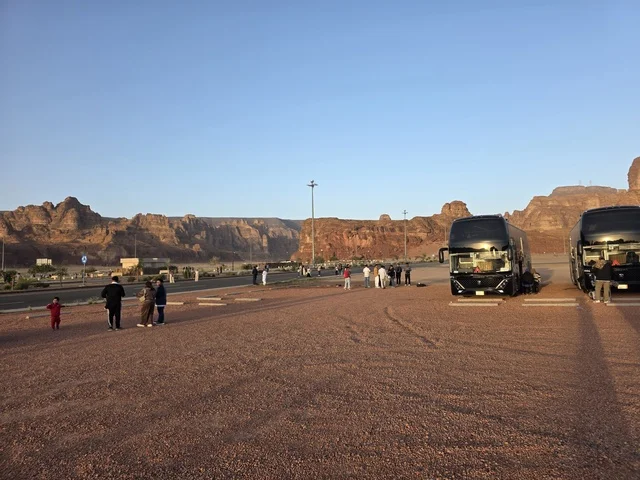 Natural sandy rock formations in the Al-Ula desert in the Kingdom of Saudi Arabia. Daylight highlights the geological terrain and sandy land under a clear sky, tourism in Al-Ula.