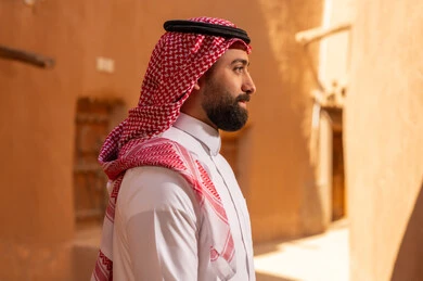 Saudi Man in Traditional Dress at Mud Heritage Site
