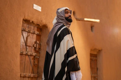 Saudi Man in Traditional Najdi Dress at Heritage Site