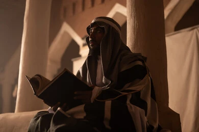 Saudi Man Reading Book in Traditional Heritage Site